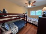 Lower level bedroom with a full size bed and a set of bunk beds Twins 